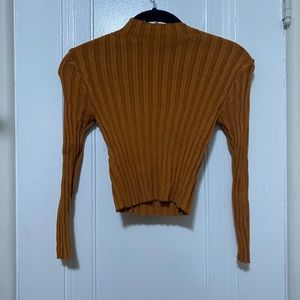 Orange turtleneck crop top